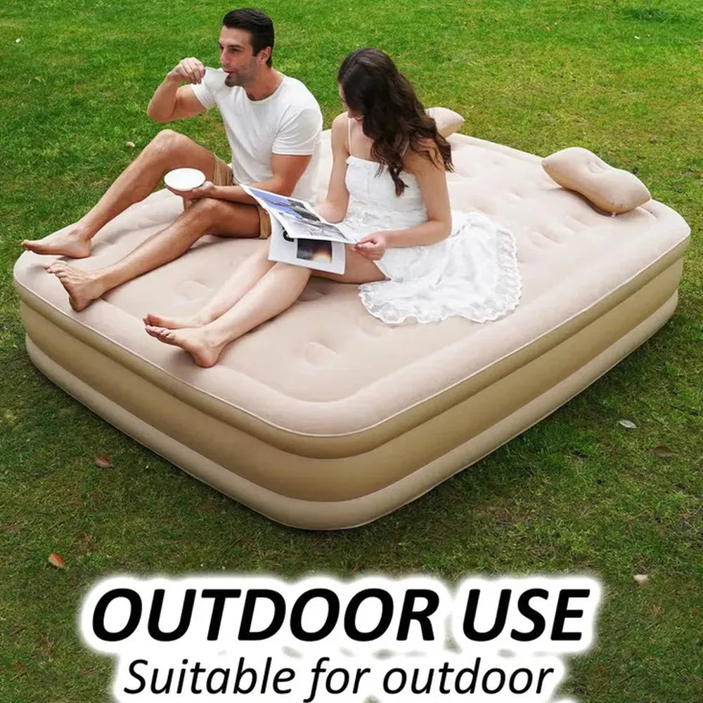 Inflatable air mattress on grass with people sitting on it, labeled 'Outdoor Use'.