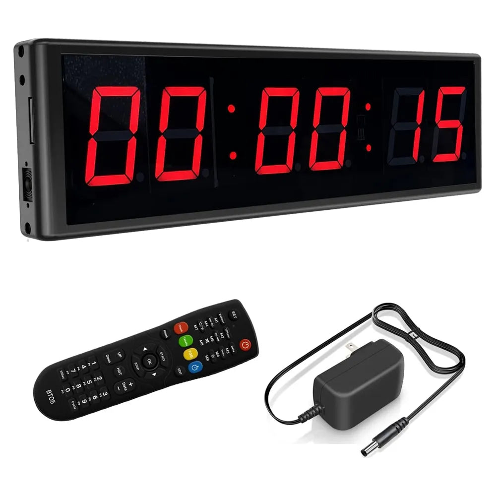 A rectangular digital LED countdown timer display with a black frame and red digits, shown with a black remote control and a black power adapter on a white background.