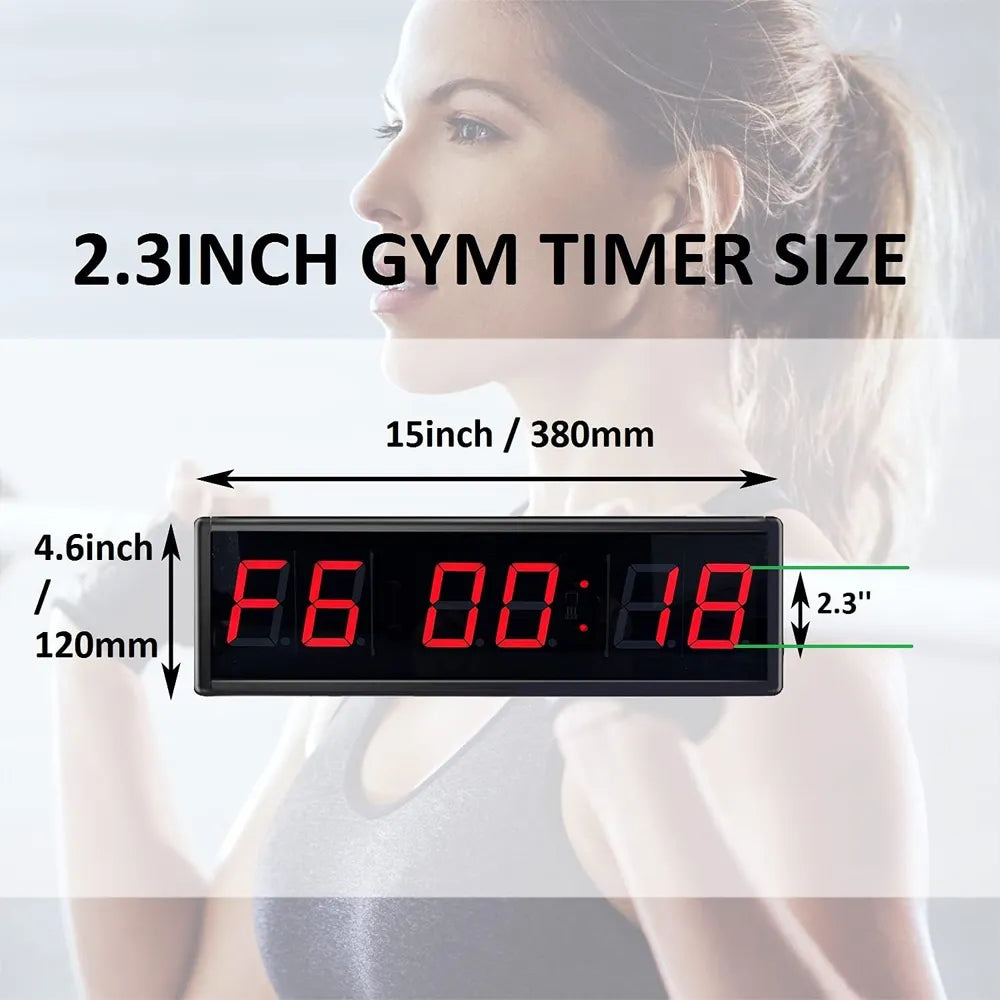 A 2.3-inch rectangular digital gym timer shown with size annotations over a blurred background of a woman.