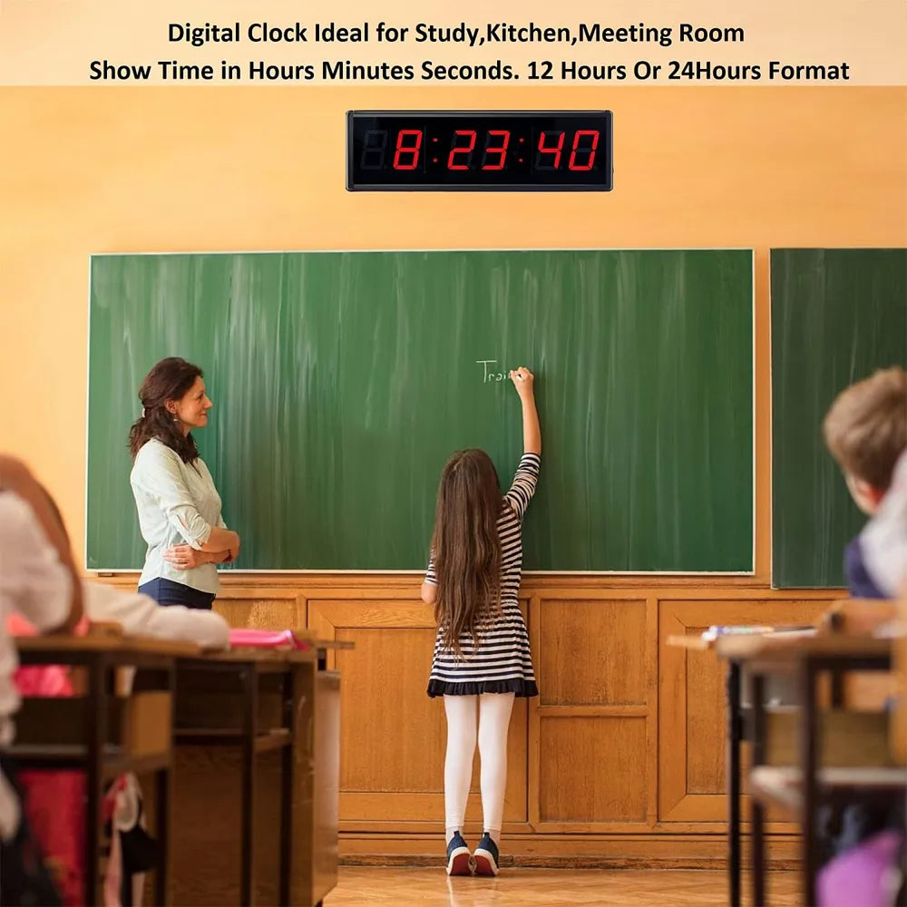 Digital clock in a classroom setting with a teacher and student at a chalkboard.