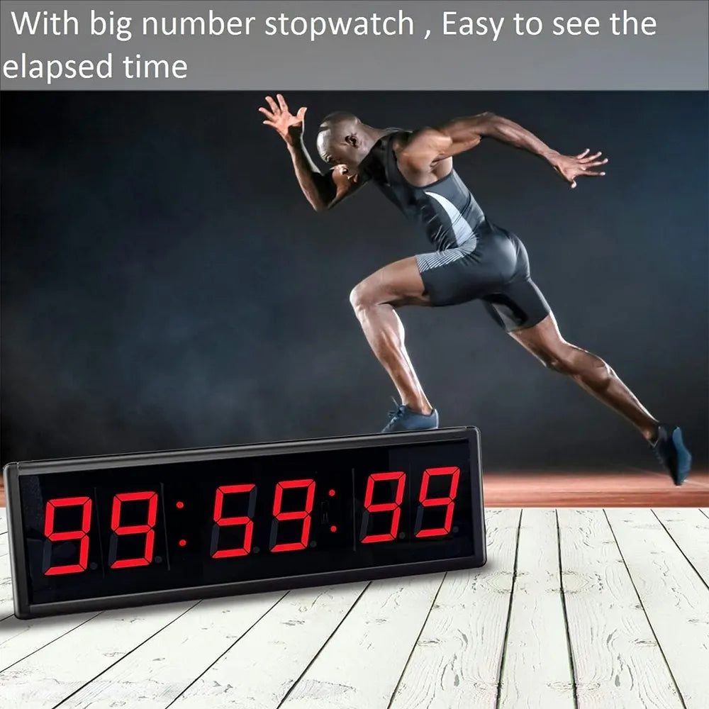 A large rectangular digital stopwatch timer with red LED numbers on a black face, shown in front of a running athlete on a track. Text at the top reads, 'With big number stopwatch, Easy to see the elapsed time.