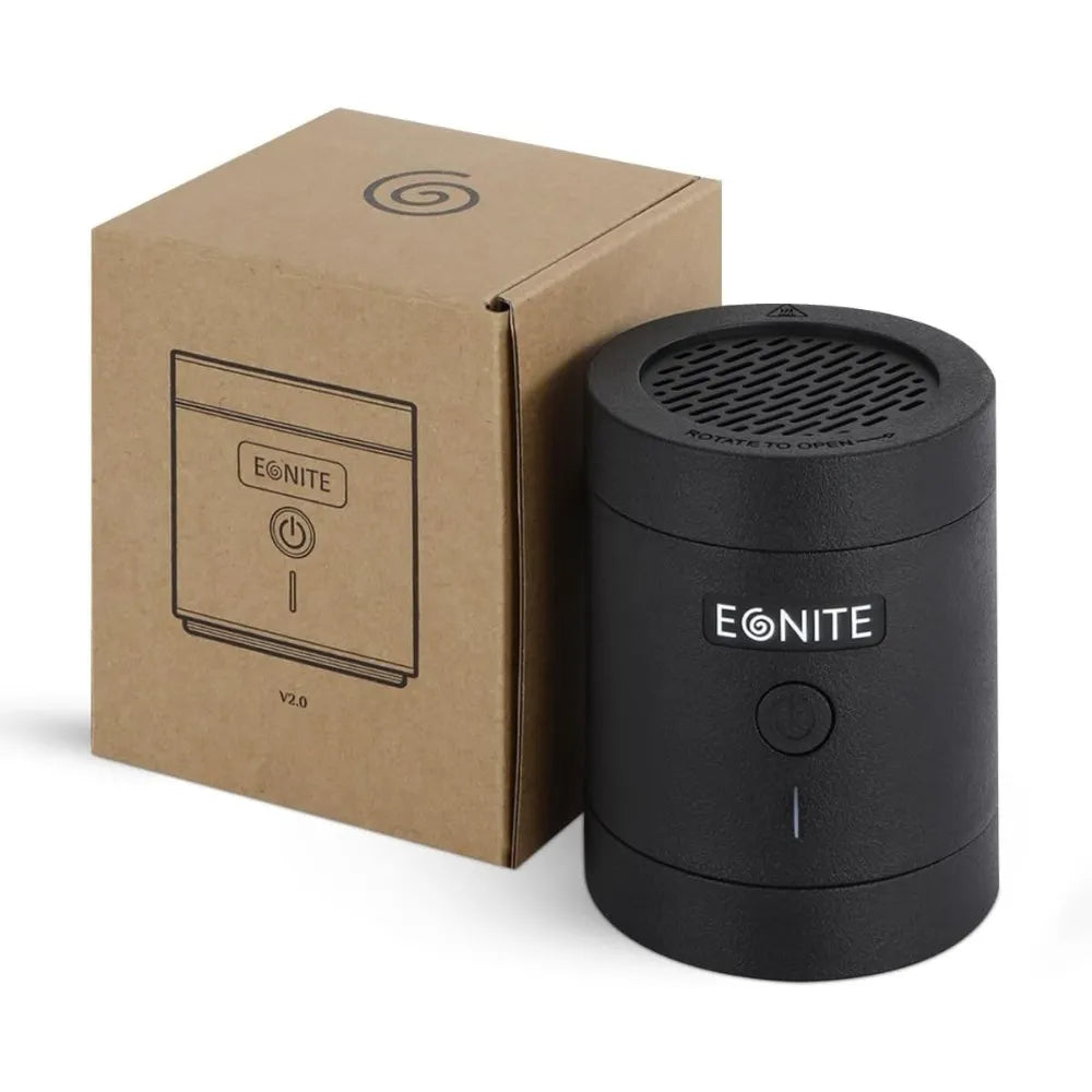 A black cylindrical EONITE portable speaker next to its brown cardboard packaging box on a white background.
