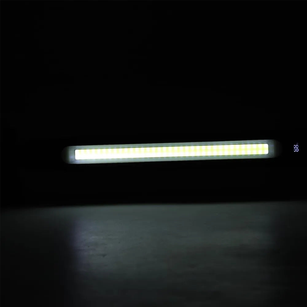 A long, narrow rectangular LED light bar glowing bright white against a very dark background, with a small blue '35' mark on the right side.