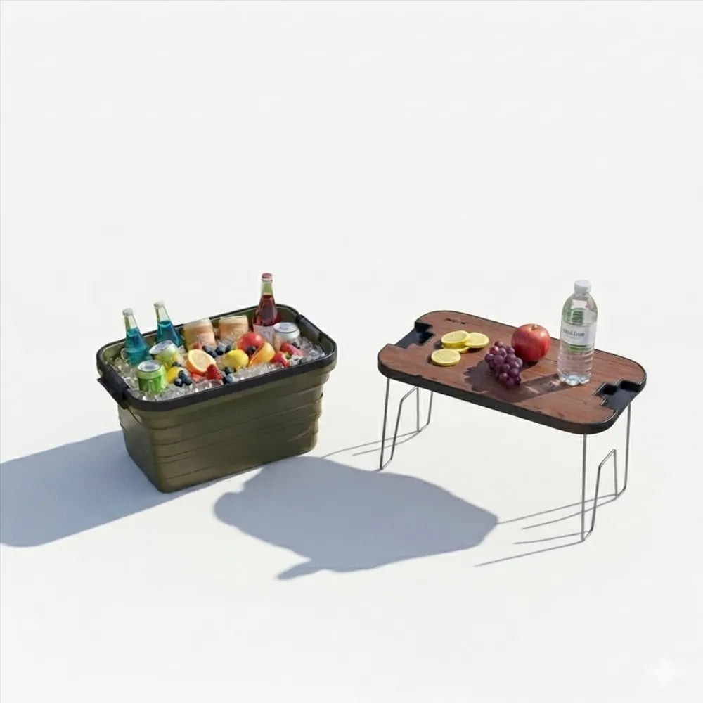 Two portable folding picnic-style tables on a clean white background. The left table holds an insulated cooler filled with ice, drinks, and fruit, while the right table holds fruit and a water bottle.