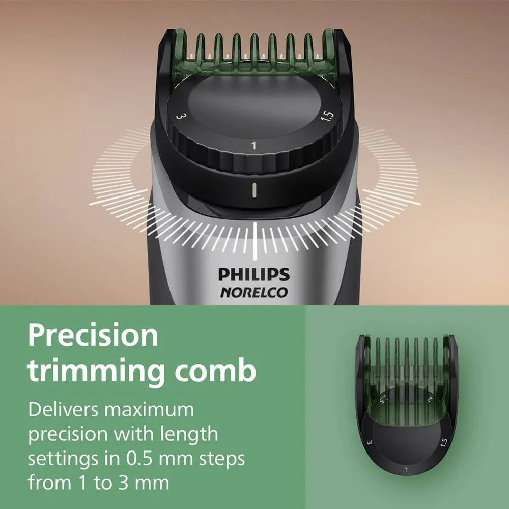 Philips Norelco precision trimming comb with adjustable length settings on a beige and green background.
