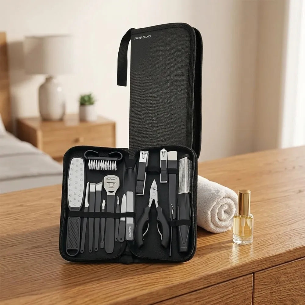 A black zippered nail care kit with multiple tools arranged inside, displayed open on a wooden table next to a rolled towel and a small bottle. The brand name 'BOROBO' is visible on the upper zipper pull.