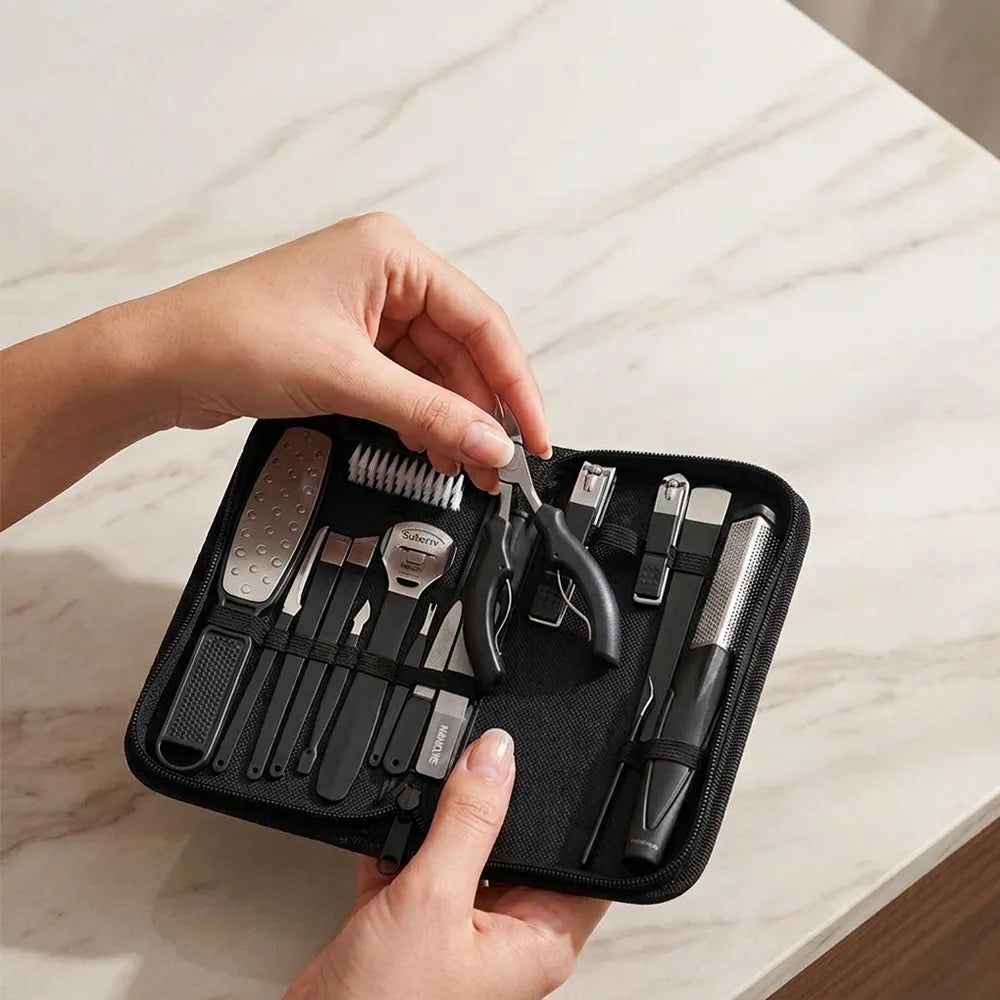 A hand-held manicure and pedicure tool set in a black zip case, shown on a light marble surface with a person's hands holding and using the tools.