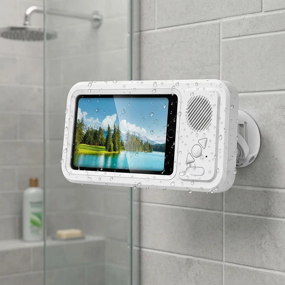 A white waterproof tablet holder mounted on a gray tiled wall in a shower area. The holder has a clear screen showing a lake landscape, water droplets on its surface, and a circular speaker on the right side.