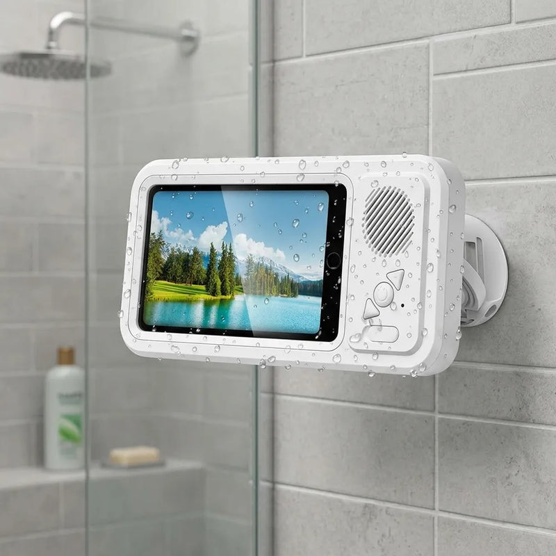 A white waterproof tablet holder mounted on a gray tiled wall in a shower area. The holder has a clear screen showing a lake landscape, water droplets on its surface, and a circular speaker on the right side.