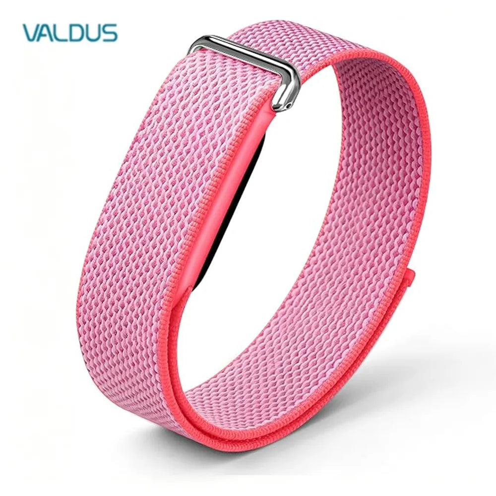 A pink woven fabric smartwatch band with a silver metal buckle, shown on a white background with the brand name VALDUS in the top left corner.