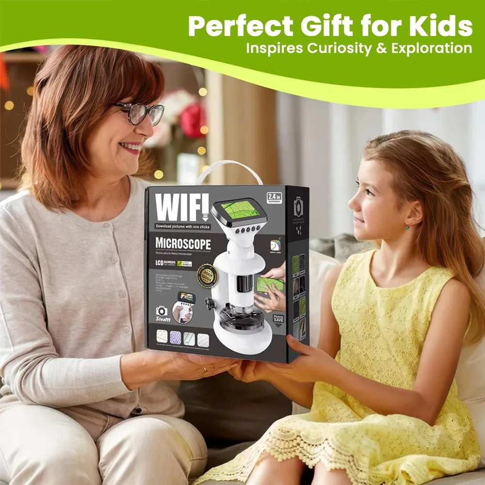 An adult woman and a young girl sit together holding a boxed kids' microscope gift set. The box is labeled 'WIFI MICROSCOPE' and shows a white microscope with a green screen.