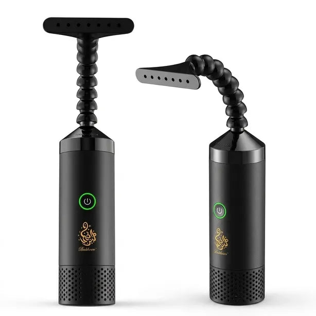 Two black handheld electric hair removal devices shown side by side on a white background, each with a flexible beaded neck and a T-shaped or angled grooming head. One device has a green power button and a gold logo, and the other shows the head detached on a flexible arm.